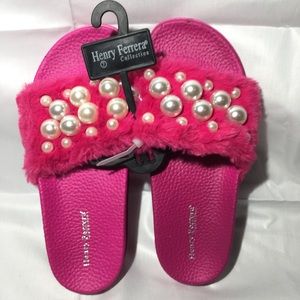 Henry Ferrera slides flip flops